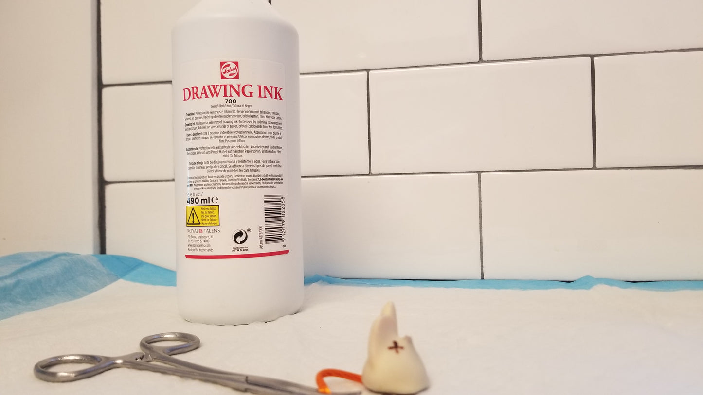 Talens Drawing Ink 700 Black bottle close up on laboratory work station. Please buy through small American company National Supply Company LLC.
